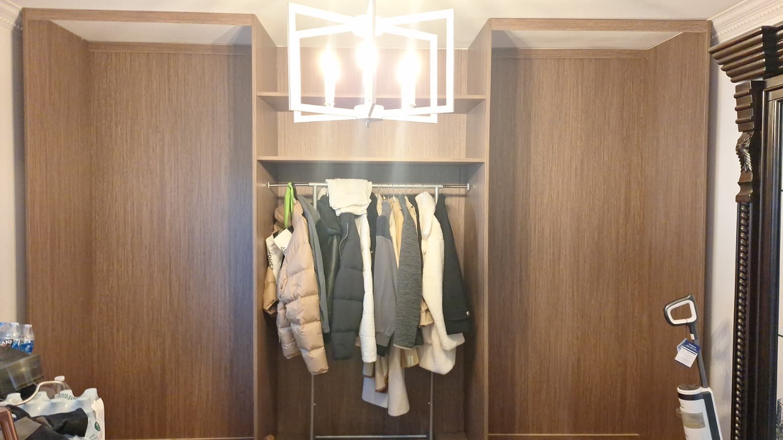 Wardrobe backing panels and central hanging space during installation