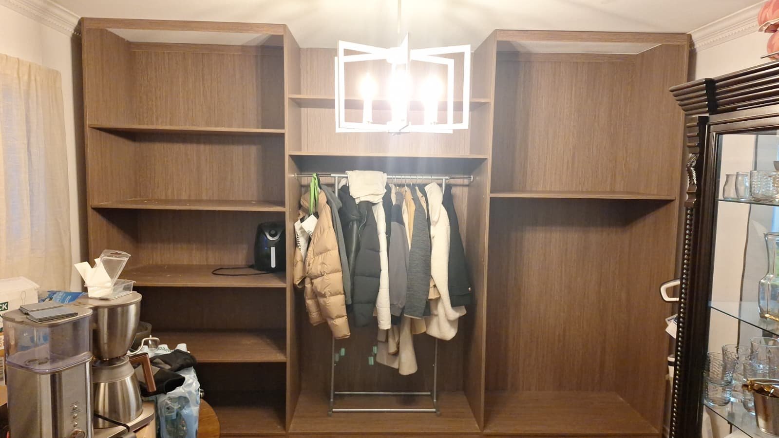 Wardrobe interior with shelves and a central hanging section