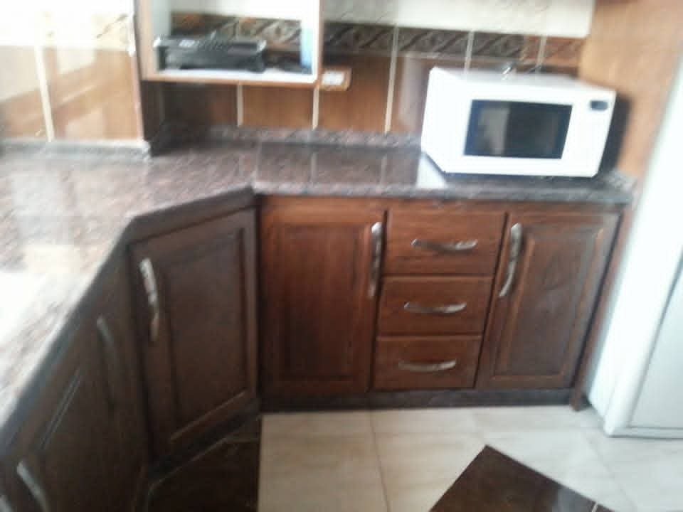 Corner base cabinets and a bank of drawers